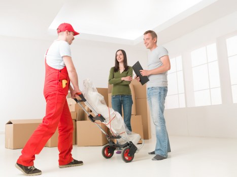 Residential moving team packing belongings for a Canary Wharf relocation